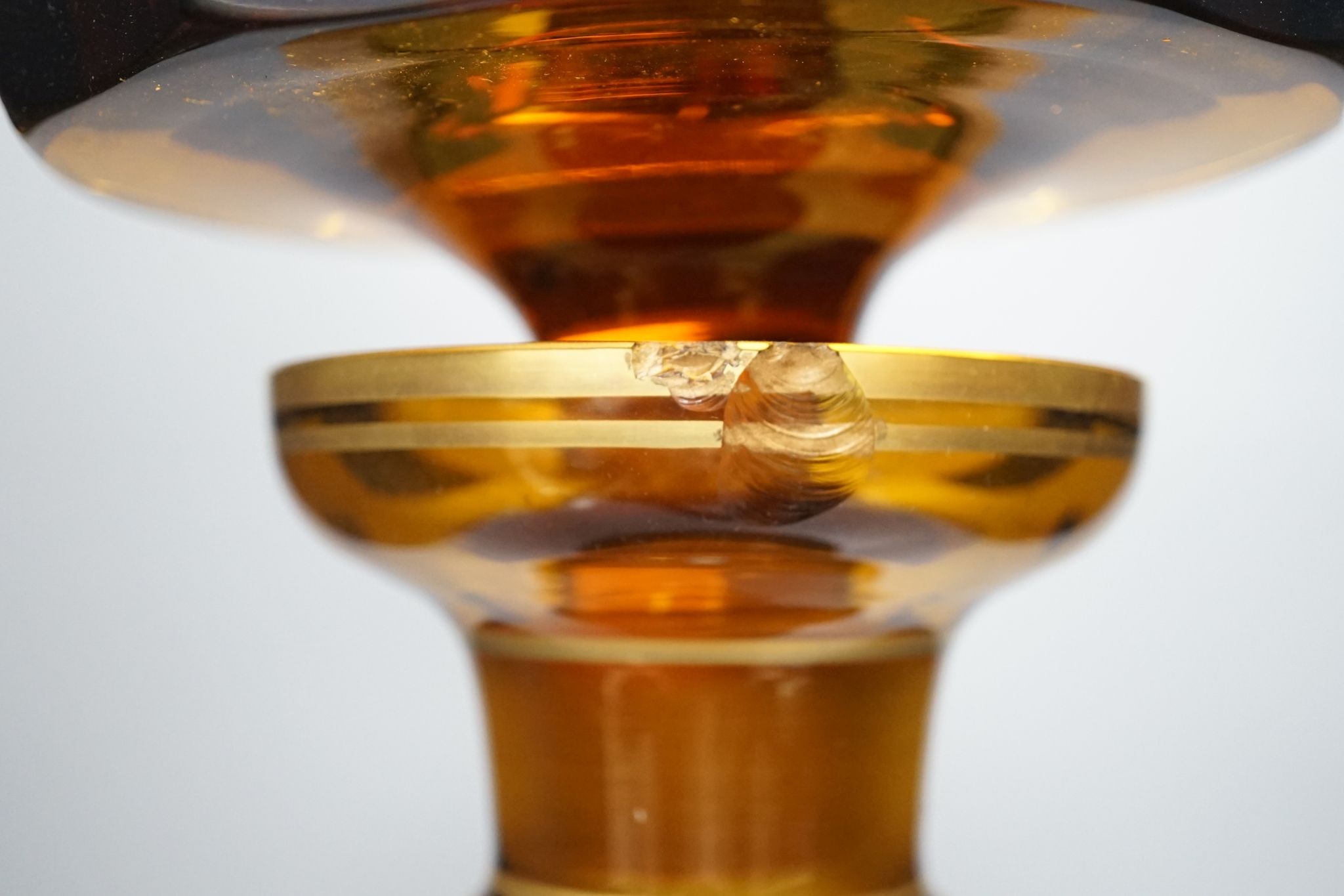 A large amber glass decanter and stopper, 74cm